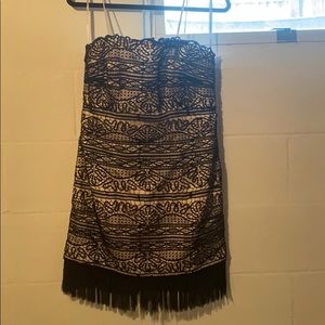 Black and nude lace dress with fringe details